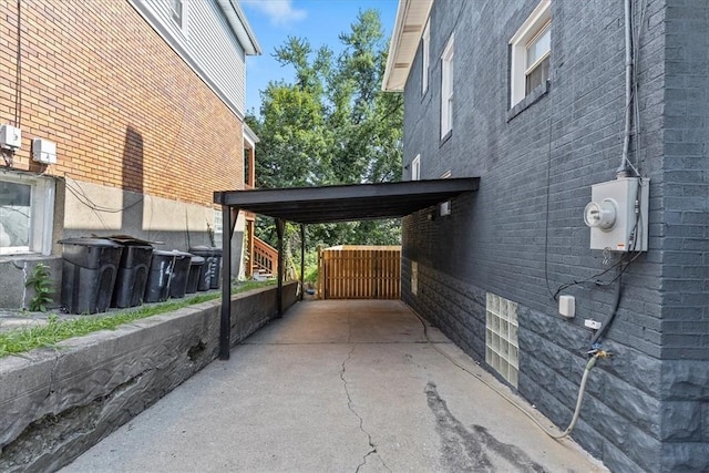 view of home's exterior featuring driveway and brick siding