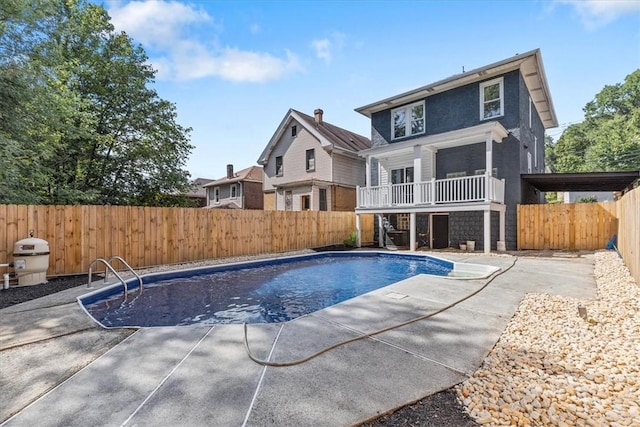 view of swimming pool with a patio, a fenced backyard, and a fenced in pool