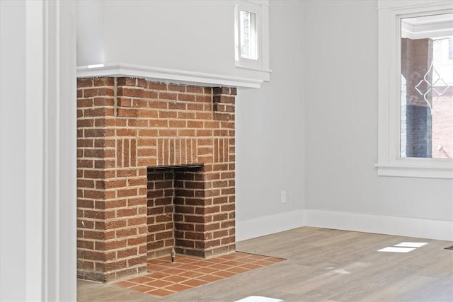 room details with baseboards and wood finished floors