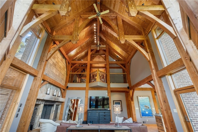 interior space with beamed ceiling, high vaulted ceiling, and wooden ceiling