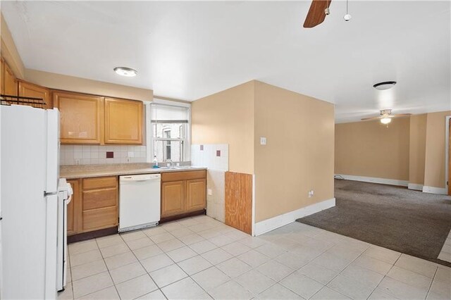 kitchen featuring white appliances, ceiling fan, light tile patterned floors, and tasteful backsplash