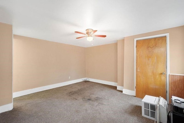 empty room with ceiling fan and carpet flooring