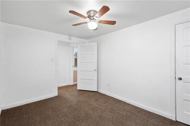 unfurnished bedroom with ceiling fan and carpet