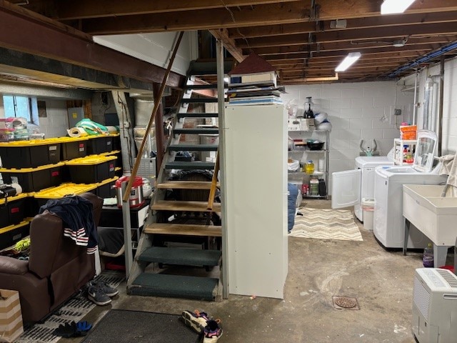 basement with washing machine and clothes dryer