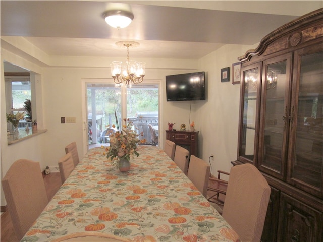 dining space with a notable chandelier