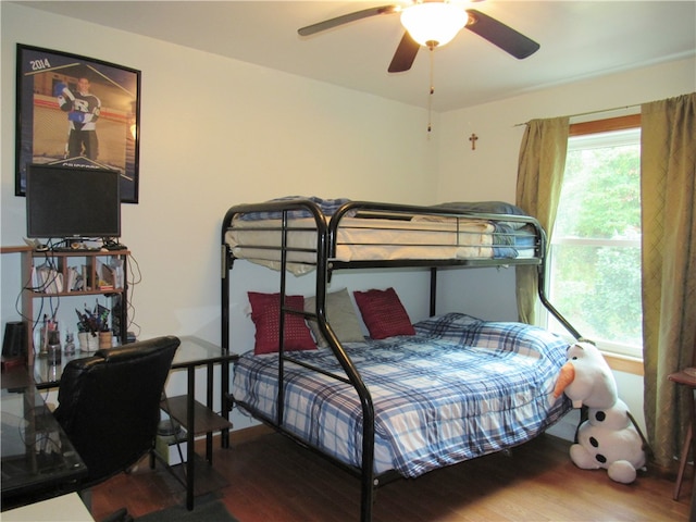 bedroom featuring ceiling fan and hardwood / wood-style floors