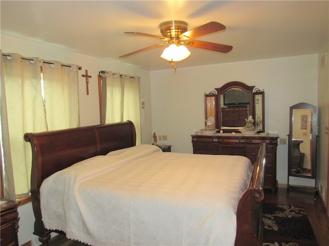 bedroom featuring dark hardwood / wood-style flooring and ceiling fan