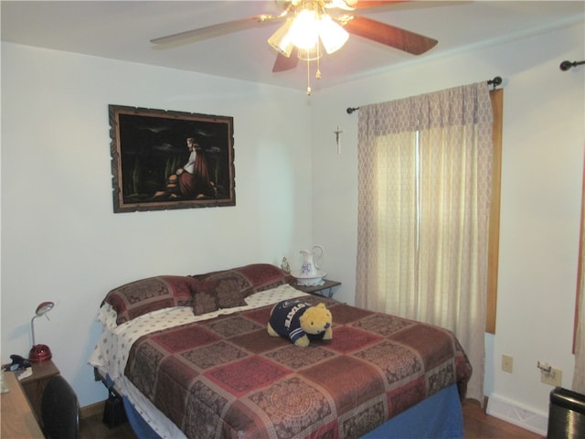 bedroom featuring ceiling fan and hardwood / wood-style flooring