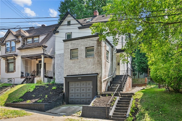 view of front of property with a garage