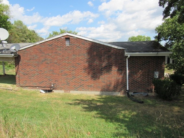 view of property exterior featuring a lawn