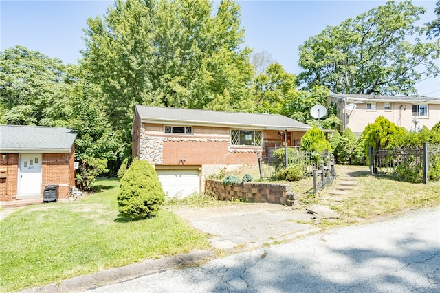 view of front of home with a garage and a front lawn