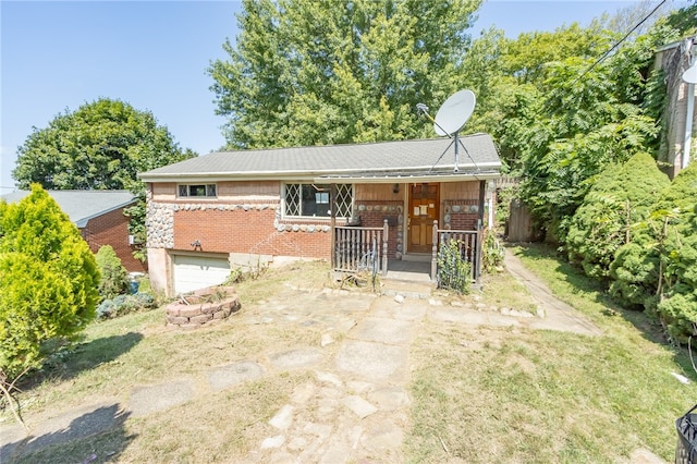 rear view of house featuring a garage