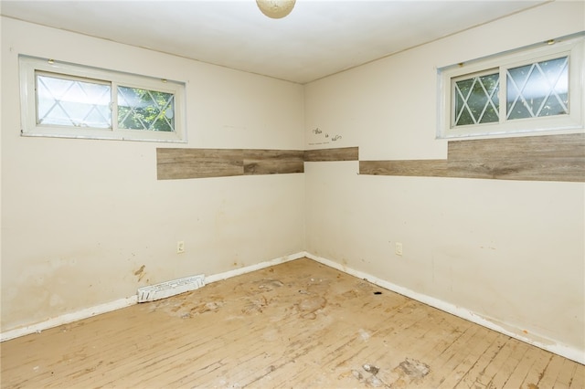 spare room with hardwood / wood-style floors