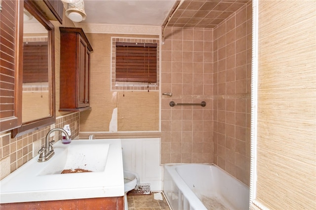 bathroom featuring backsplash, tile walls, vanity, and tile patterned floors