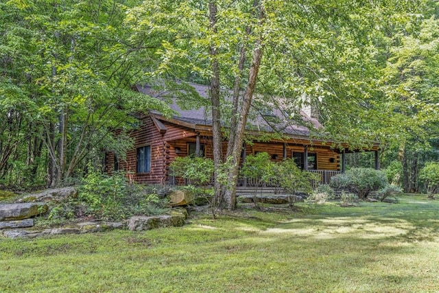 view of yard with covered porch