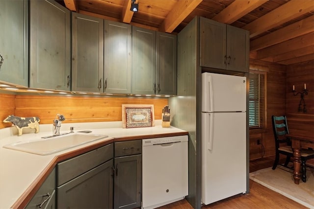 kitchen with light wood-type flooring, beamed ceiling, wood ceiling, and white appliances