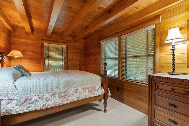 bedroom featuring multiple windows, beamed ceiling, and wooden ceiling