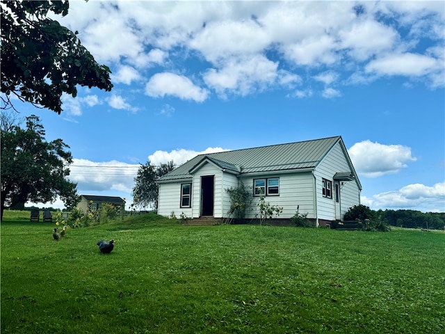 view of property exterior featuring a lawn