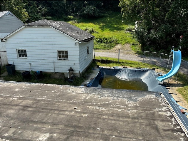 view of side of home with fence