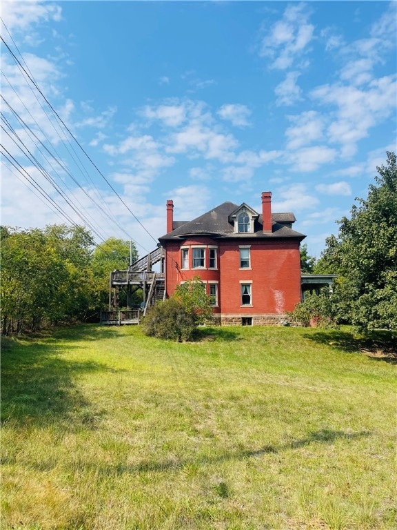 back of house with a yard