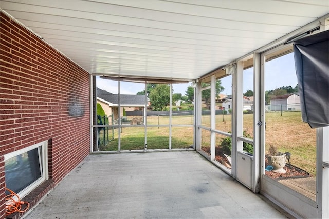 unfurnished sunroom featuring plenty of natural light