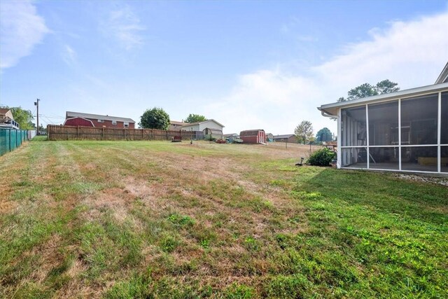 view of yard with a sunroom