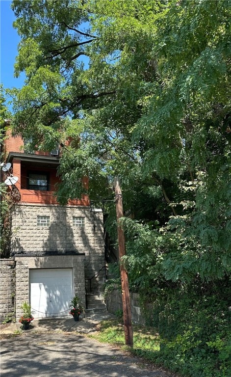 view of property exterior featuring a garage