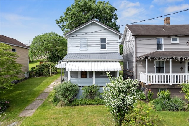 view of front of house featuring a porch and a front yard