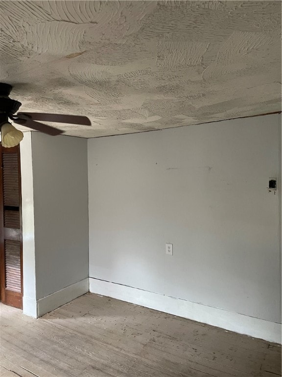 spare room with ceiling fan