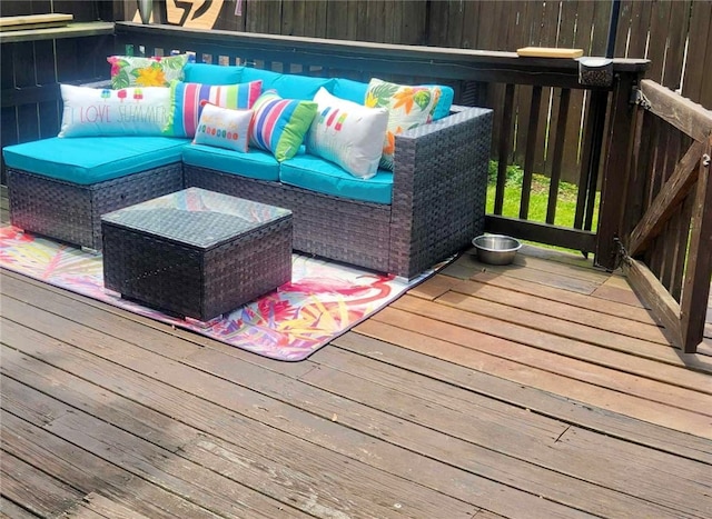 wooden deck featuring an outdoor hangout area