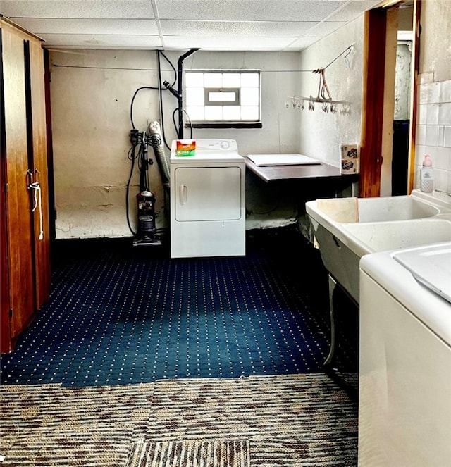 washroom with laundry area, dark colored carpet, and washer / dryer