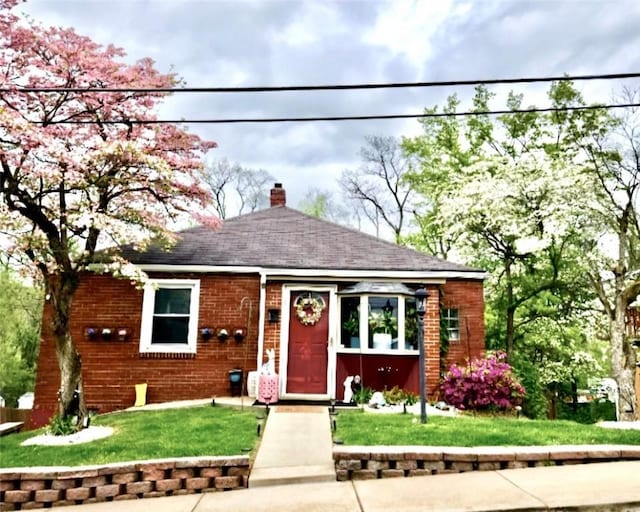 201 Esther Ave, New Kensington, PA 15068 - view of front of house with a chimney and a front yard