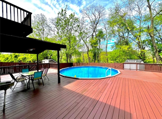 201 Esther Ave, New Kensington, PA 15068 - view of pool featuring a deck, a fenced backyard, outdoor dining area, and view of scattered trees