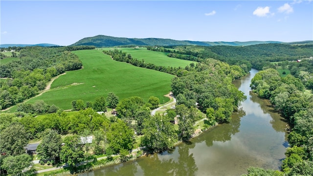 bird's eye view with a water and mountain view