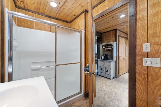 bathroom with wooden ceiling, tile patterned flooring, walk in shower, and vanity