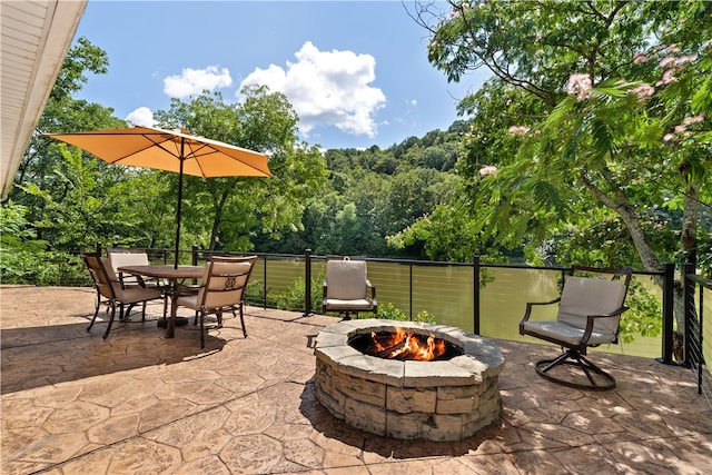 view of patio / terrace featuring an outdoor fire pit