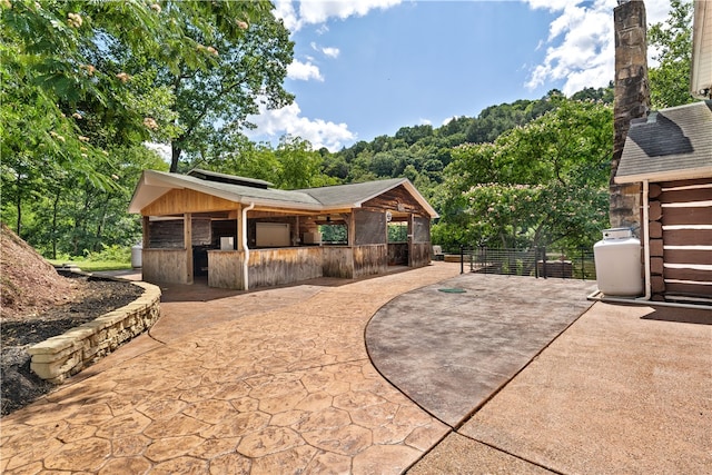 view of front facade with a patio area