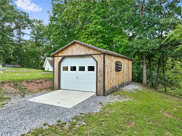 garage with a lawn