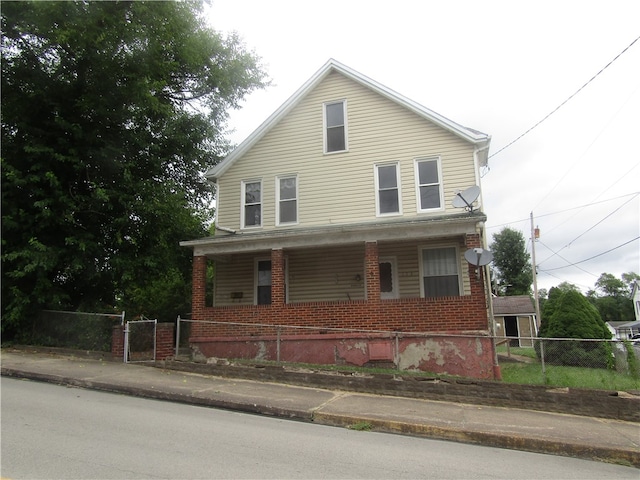 view of front of property featuring covered porch