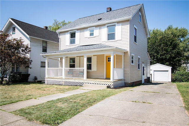 view of front of house with a garage, a front lawn, an outdoor structure, and covered porch