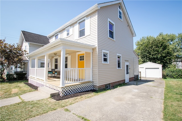 view of front of property with a porch, an outdoor structure, a garage, and a front lawn