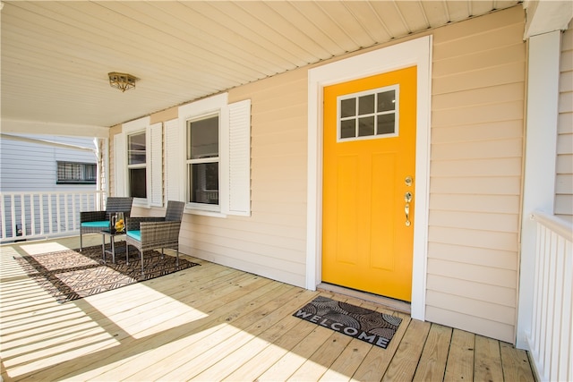 property entrance featuring a porch