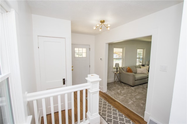 corridor featuring hardwood / wood-style floors