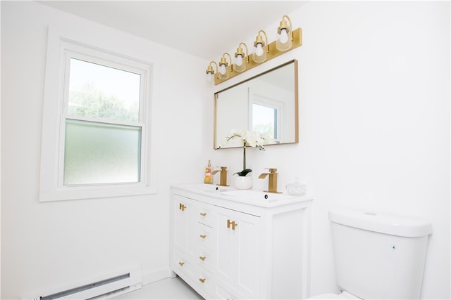 bathroom with a baseboard heating unit, toilet, and vanity