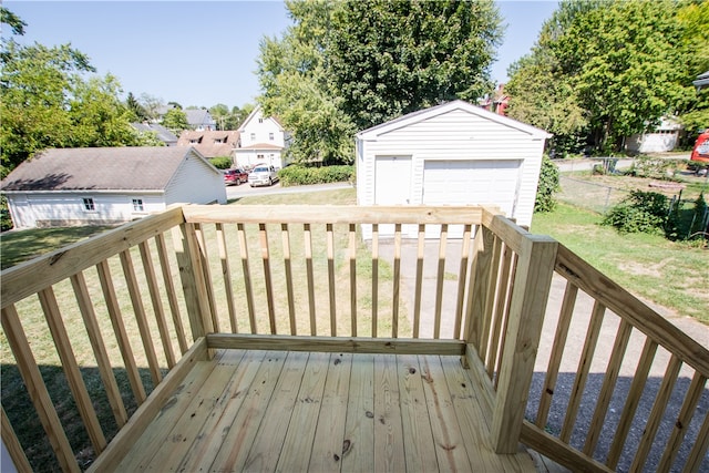 deck with an outbuilding, a yard, and a garage