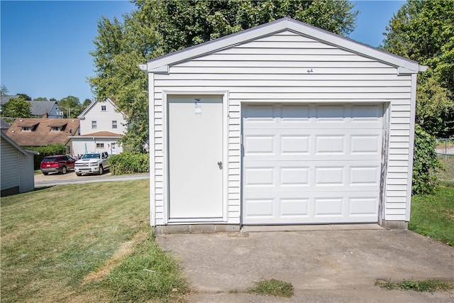 garage featuring a lawn