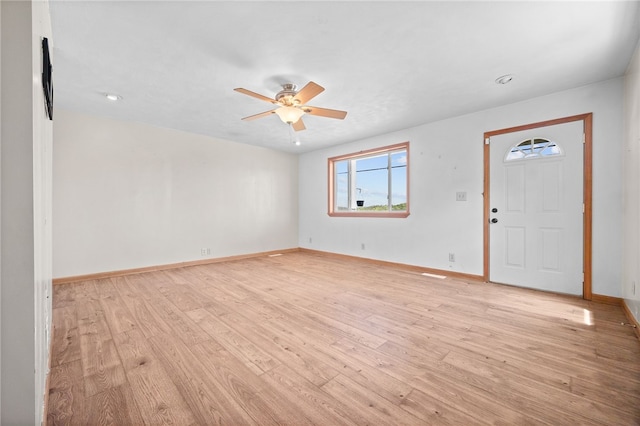 entryway with ceiling fan and light wood-type flooring