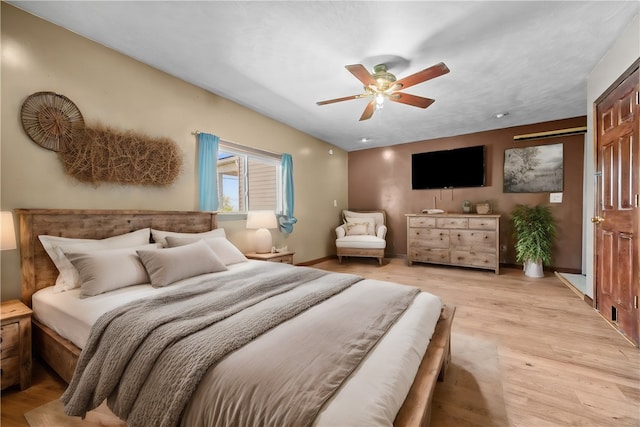 bedroom featuring ceiling fan and light wood-type flooring