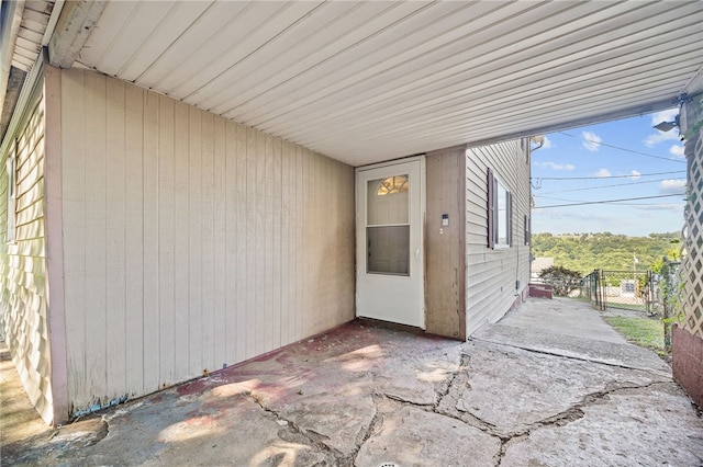 property entrance featuring a patio