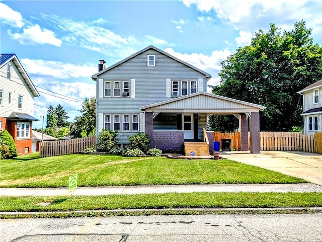 view of front of home featuring a front lawn and a porch